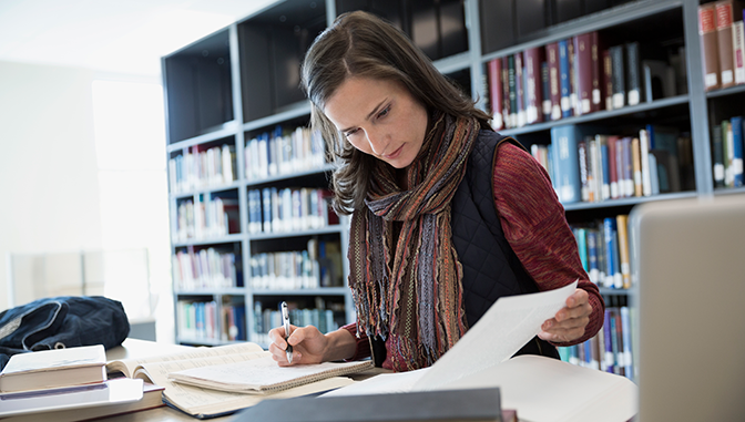 woman studying in library