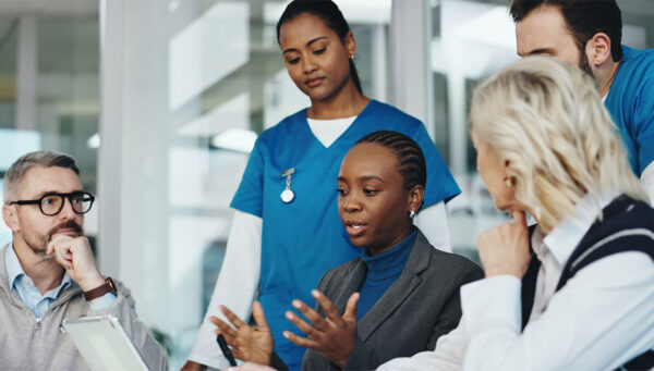 Health Science professionals gathered together in a meeting