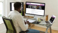 Student at desktop computer browsing Excelsior's online university areas of study