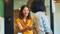 Smiling woman shaking hands