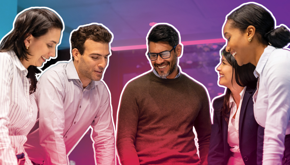 Smiling businesspeople collaborating on a project.