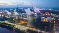 Steam rising from a nuclear power plant at dusk