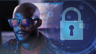 Blue lock icons swirl next to a Certified Ethical Hacker viewing code in a darkened room.