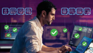 Man intensely working on multiple screens and ticking through a cybersecurity checklist