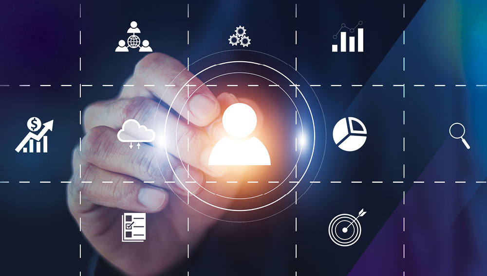 Hand reaching for a person icon on a grid representing a CRM system
