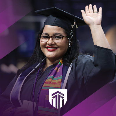 student at graduation smiling with the Excelsior logo and purple stripes