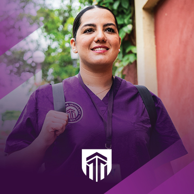 Excelsior University student in purple scrubs for the St. Petersburg site.